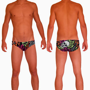 1987 Skulls Mens Water Polo Suit  Features:  Compression Fitting PBT/Polyester Blend Fabric with Four-way stretch technology Dual Layer Lined Brief Low Stretch Flat Drawcord Flatlock Stitch Construction prevents chafe Turned In Liner Seams for Optimum Comfort Chlorine Resistant Fabric